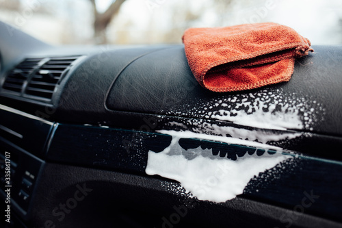 Microfiber cloth and foam on a car cockpit. Auto clean concept 