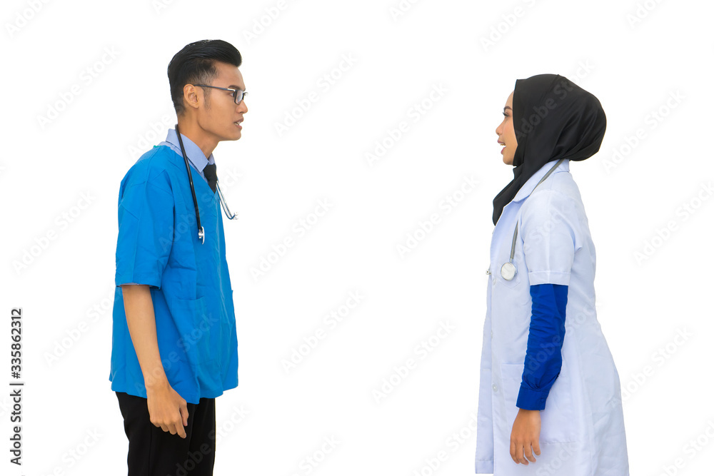 Two angry Asian muslim doctor blaming and accusing each other. Medical worker concept on white background. Two angry Asian muslim doctor blaming and accusing each other. Medical worker concept on white background.