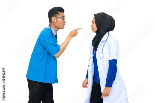 Two angry Asian muslim doctor blaming and accusing each other. Medical worker concept on white background.