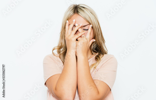  Woman covers his face by hand