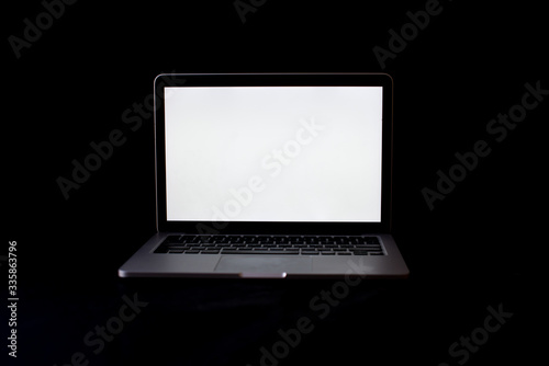 Laptop Isolated on black background. Open blank browser. silver laptop on a black background. Copy space. 