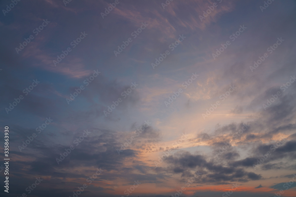 Background of colorful sky concept, Dramatic sunset with twilight color sky and clouds.