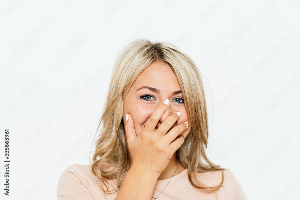 Girl laughs and covers her mouth Girl laughs and covers her mouth