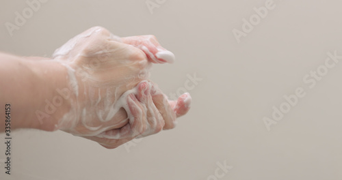 man washing his hands with soap closeup