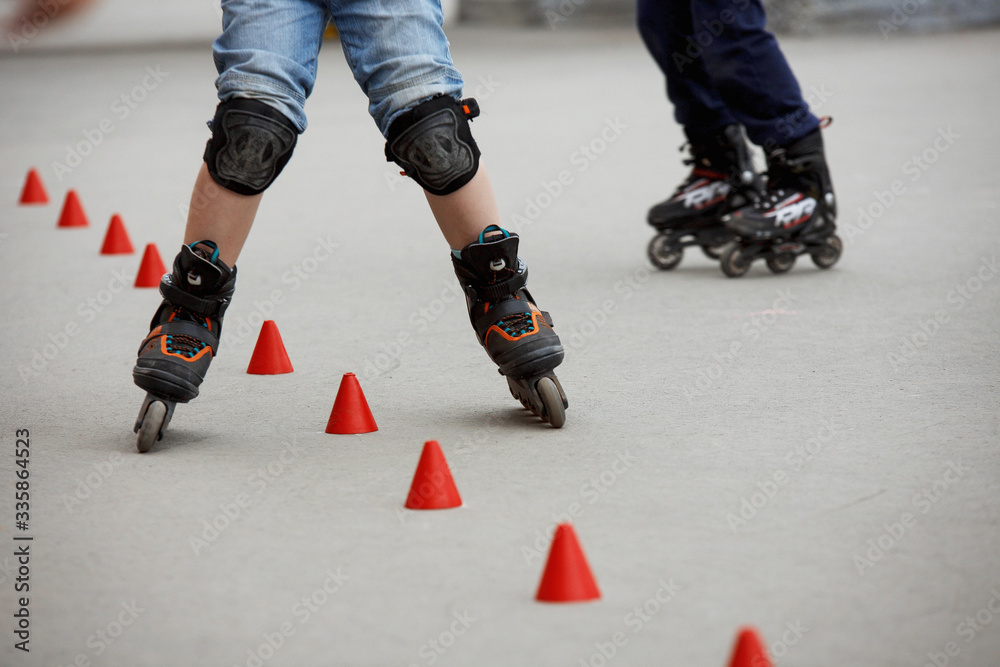 inline skates moving through a skatepark. freestyle slalom inline skates moving through a skatepark. freestyle slalom