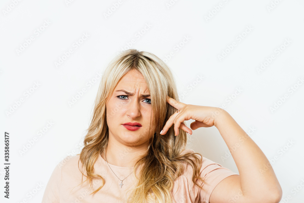 Woman thinking with finger to his temple. Woman thinking with finger to his temple.