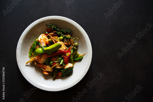 Top view Stir fried seafood on dark gray background, thai famous food background concept