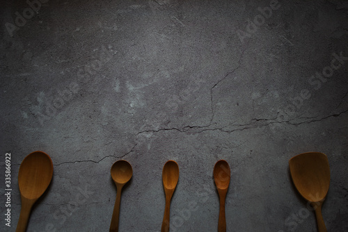 wooden spoons at bottom with copy space on top, background for food concept