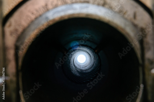 View through the barrel of a 105mm Light Field Gun Howitzer showing spiral rifling which spins the shell and improves accuracy photo