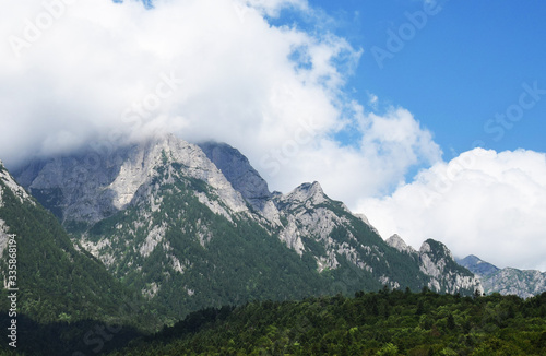 mountain peaks covered by clouds