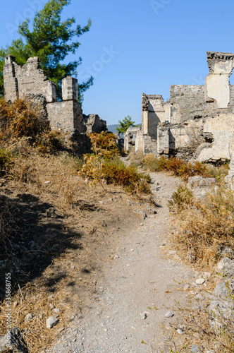 Ruins at the former Greek village of Kayakoy in Turkey, abandoned 1922, now a museum and also known as the Ghost Town. photo