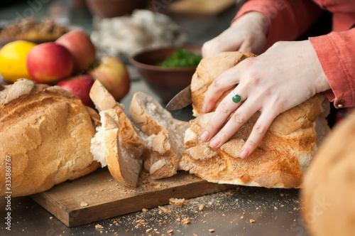 Cutting bread on a wooden Board