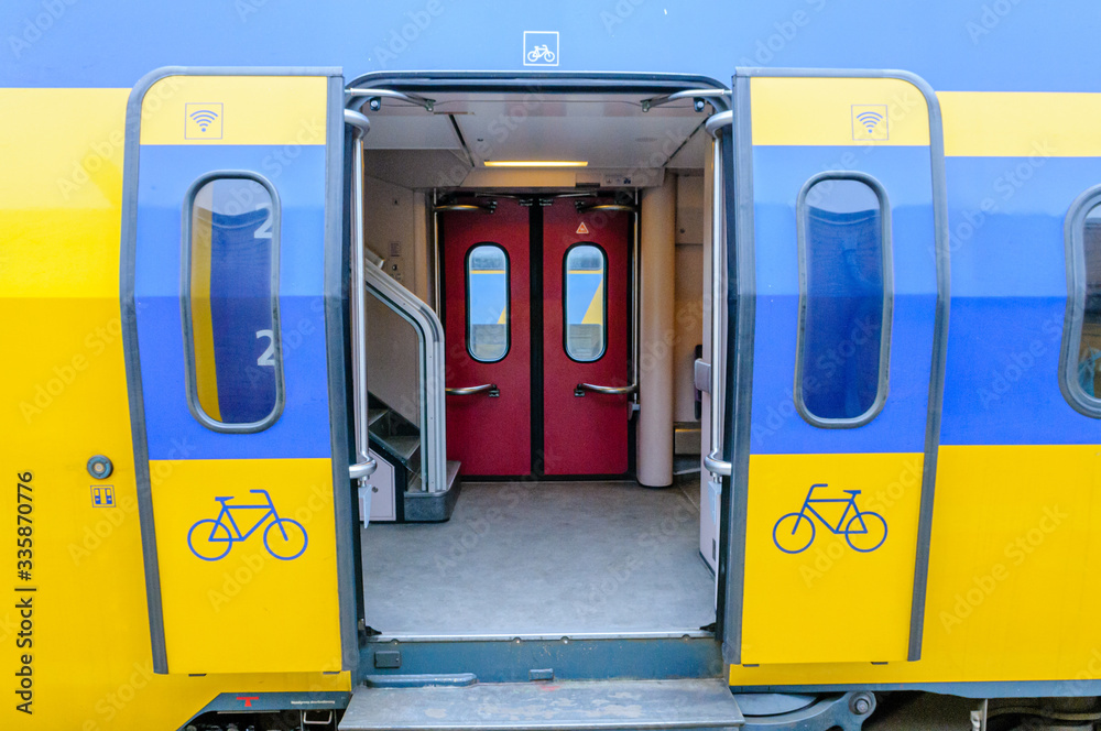 Yellow and blue train at a platform