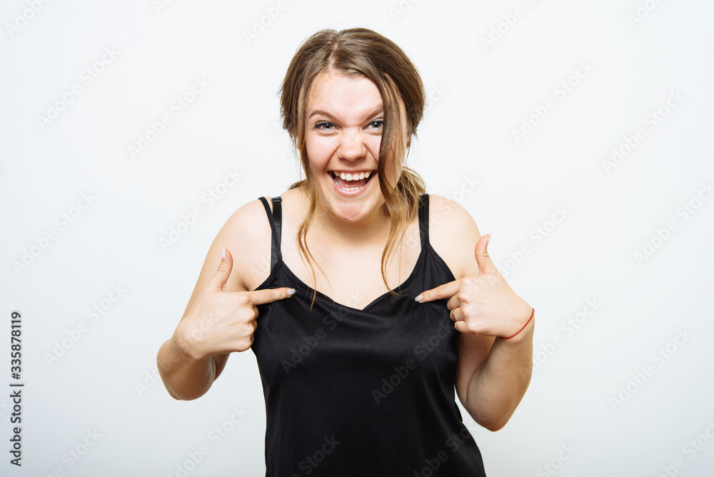 A woman asks who I am, showing on themselves fingers. A woman asks who I am, showing on themselves fingers.