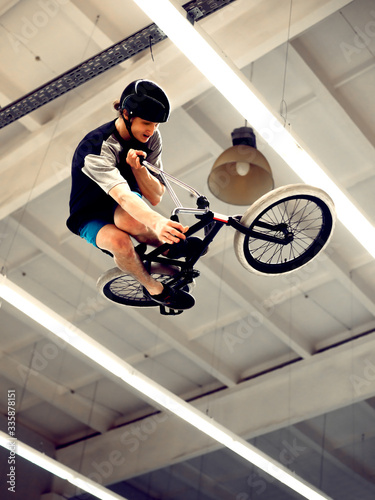 BMX Rider Doing Extreme Tricks on Bike in the Skatepark. Healthy and Active Lifestyle.