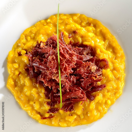 Photos Pumpkin risotto with dried meat..