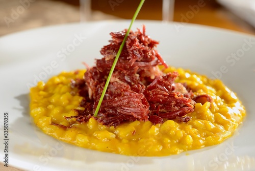 Photos Pumpkin risotto with dried meat..