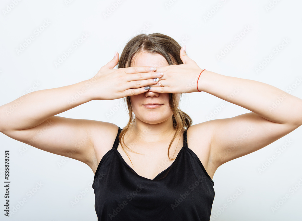 woman closes eyes with her hands woman closes eyes with her hands