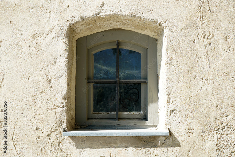 old window in a stone wall