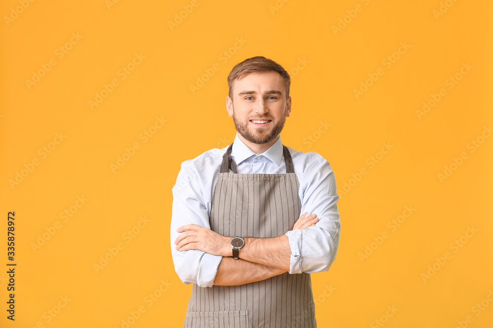 Handsome male bartender on color background Handsome male bartender on color background