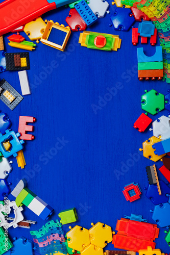 Multi-colored children's development games designer toys on a blue background