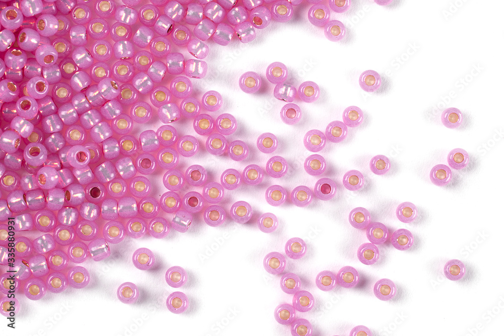 Isolated beads on a white background, scattered beads, pink beads Isolated beads on a white background, scattered beads, pink beads