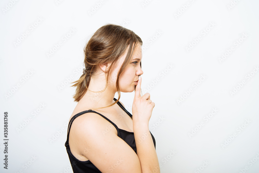 Fototapeta premium woman put finger on her lips
