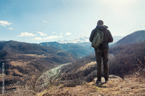 Hiker takes photo of beautiful mountains © Юрий Бартенев