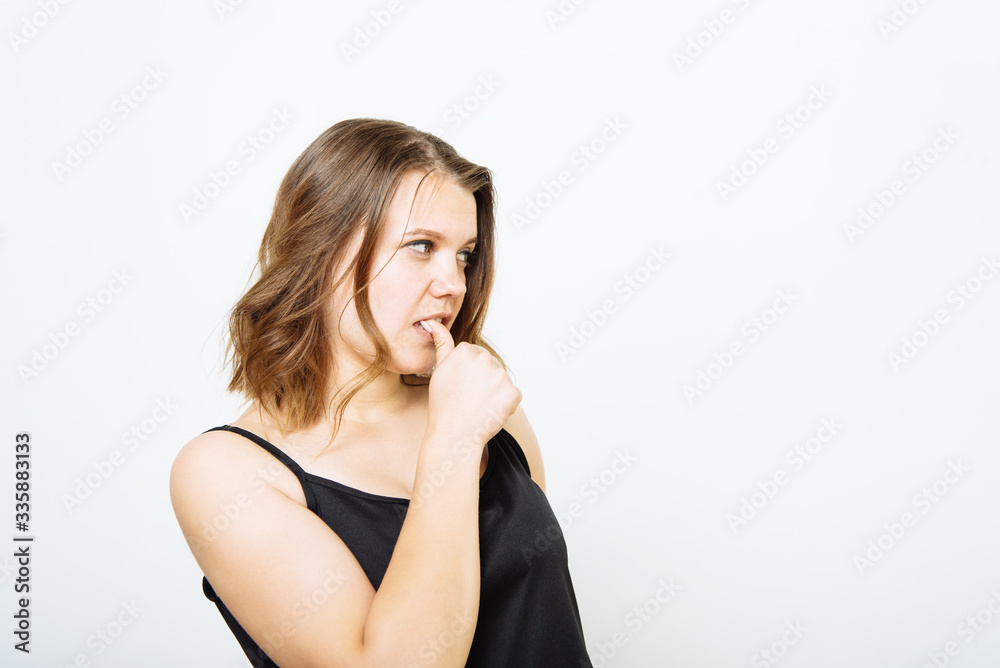 Woman bites his nails Woman bites his nails