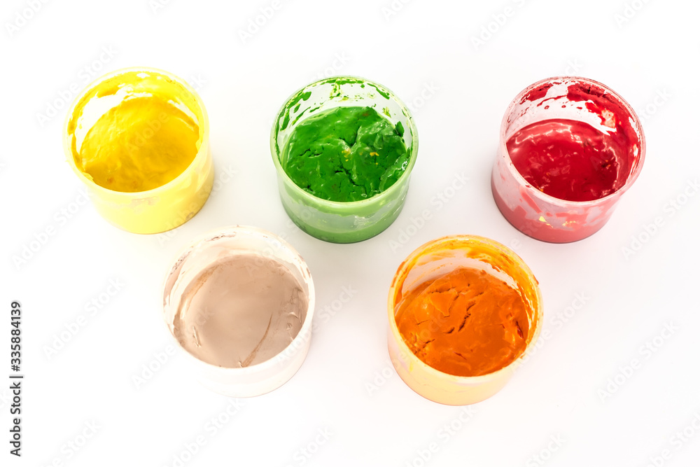 jars with acrylic paint on white background jars with acrylic paint on white background
