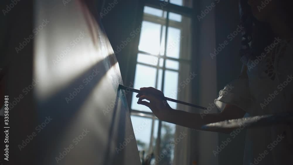woman artist paint by window with brushes and oil dye