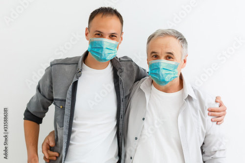 COVID-19 Pandemic Coronavirus Men wearing face mask protective for spreading of disease virus SARS-CoV-2. Man with surgical mask on face against Coronavirus Disease 2019.