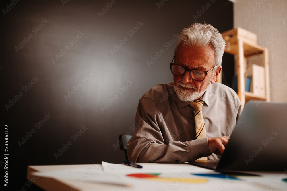 Good job! Elderly man is giving thumb up for presentation held by his partner at the office.