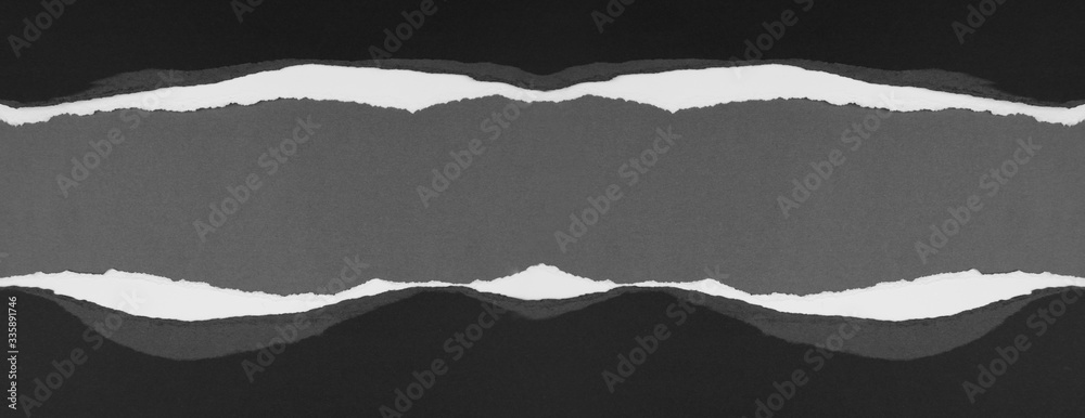 Ripped paper on grey Ripped paper on grey
