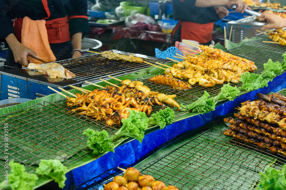 Skewers of port and chicken on sale at a street food stall, Bangkok, Thailand