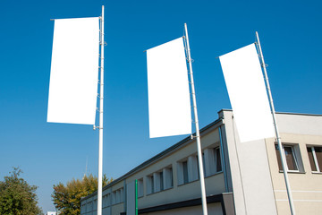 Blank white advertising flags in the front of the building