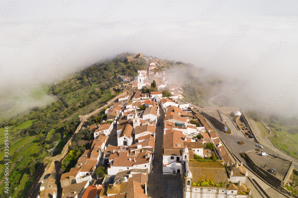 Obraz premium Monsaraz drone aerial view on the clouds in Alentejo, Portugal