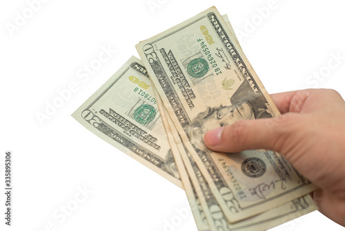 Hand holding money dollars isolated on white background.