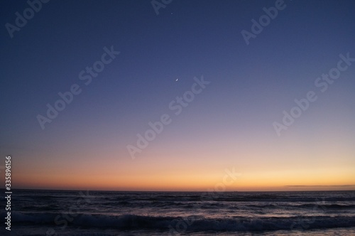 sunset over the sea, Venus and the moon. © Marcin