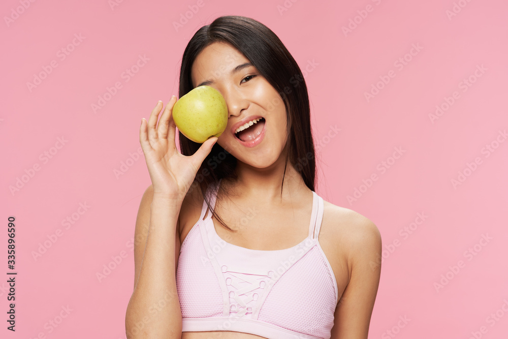 young woman holding an apple young woman holding an apple