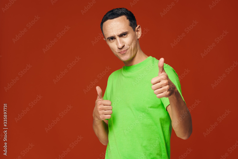 young man showing thumbs up young man showing thumbs up