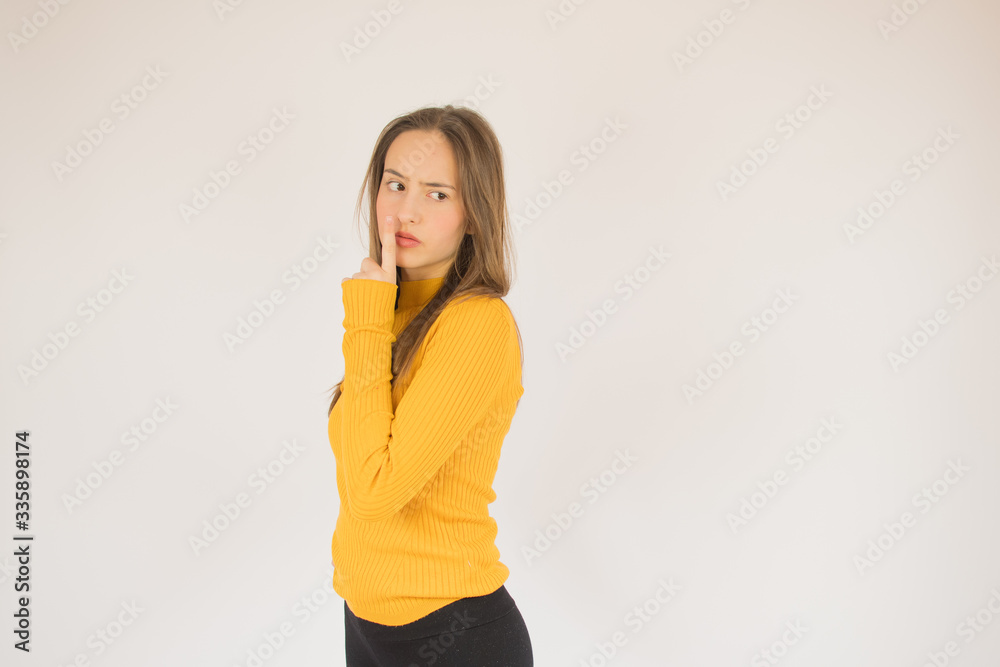 Beautiful young girl with yellow shirt thoughtful Beautiful young girl with yellow shirt thoughtful