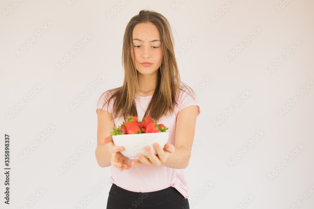 beautiful fitness girl with strawberries beautiful fitness girl with strawberries