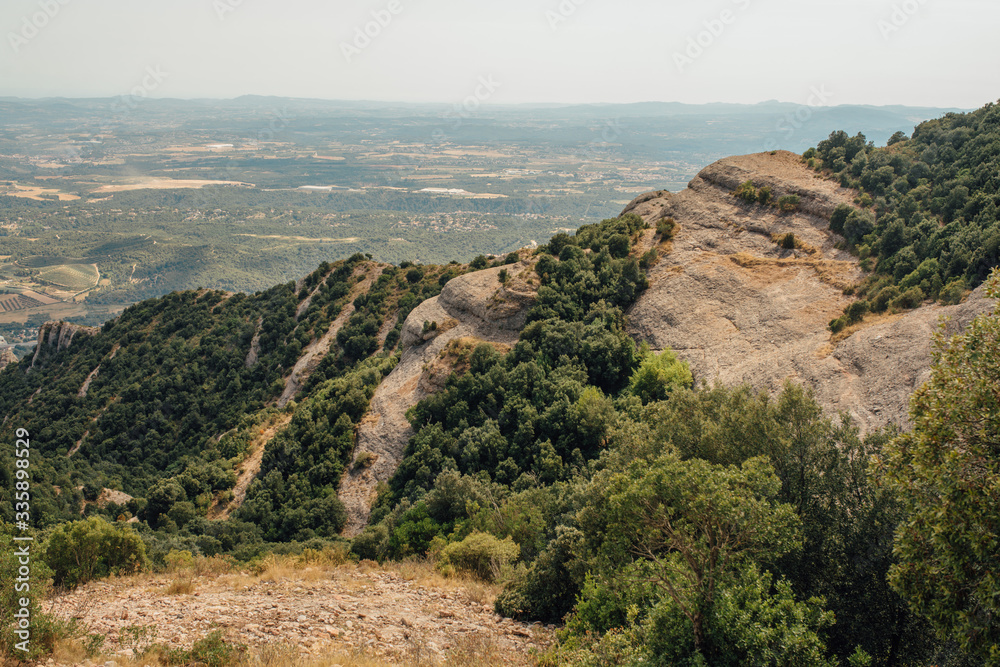 A mountain view with monastery on the top in Montserrat, Spain A mountain view with monastery on the top in Montserrat, Spain