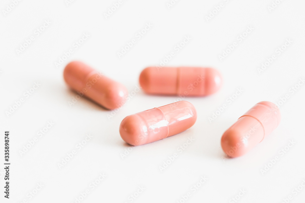 Pills on a light background with place for text. Biological supplements, vitamins, medicines for health. Pills on a light background with place for text. Biological supplements, vitamins, medicines for health.