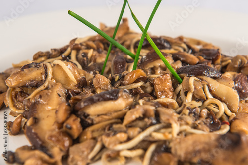 Plate of siitake mushrooms with baby eels