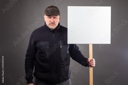 A disgruntled man with a pl...