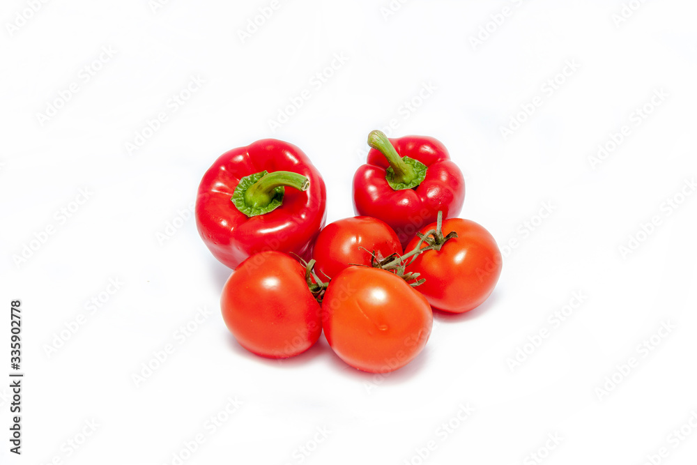 red tomatoes and peppers on a white background red tomatoes and peppers on a white background