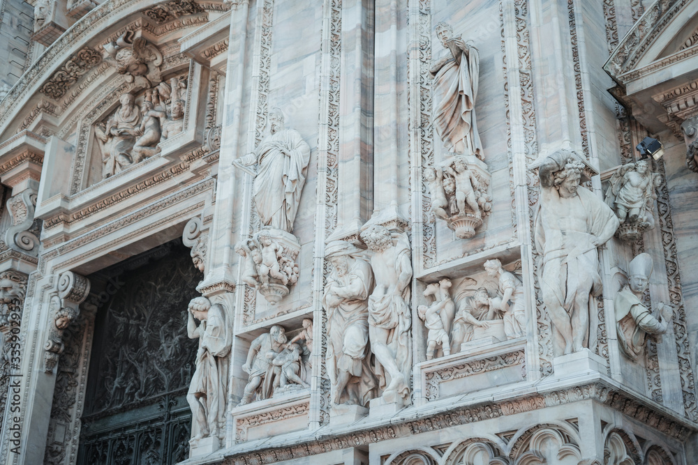 detail of the door of the cathedral in milano duomo