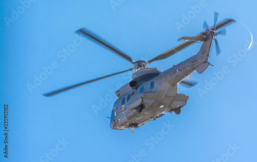 Spanish Army Hellicopter patroling during COVID-19 Lockdown, Las Palmas de Gran Canaria, Spain photo